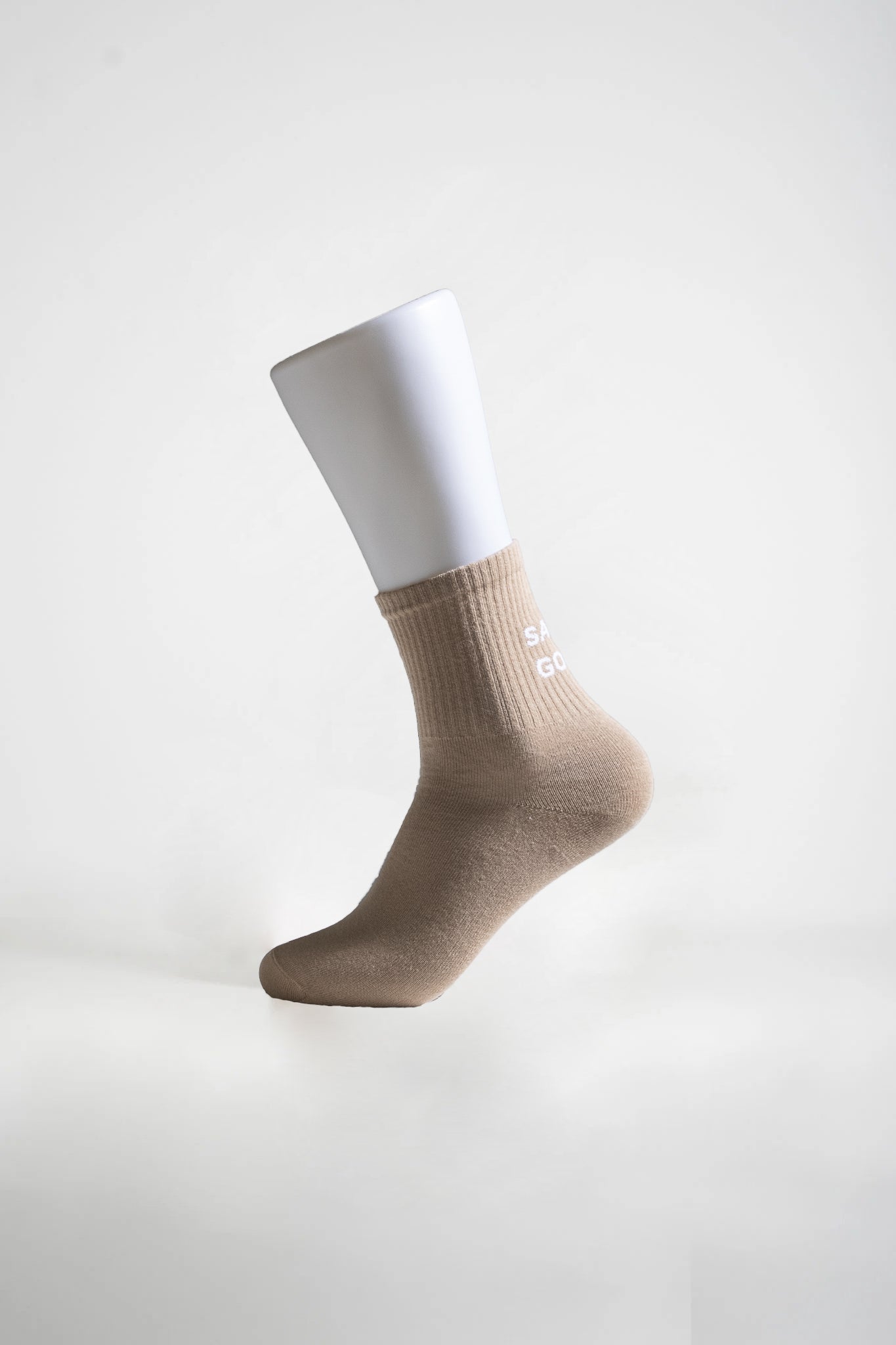 Sukat tekstillä beige